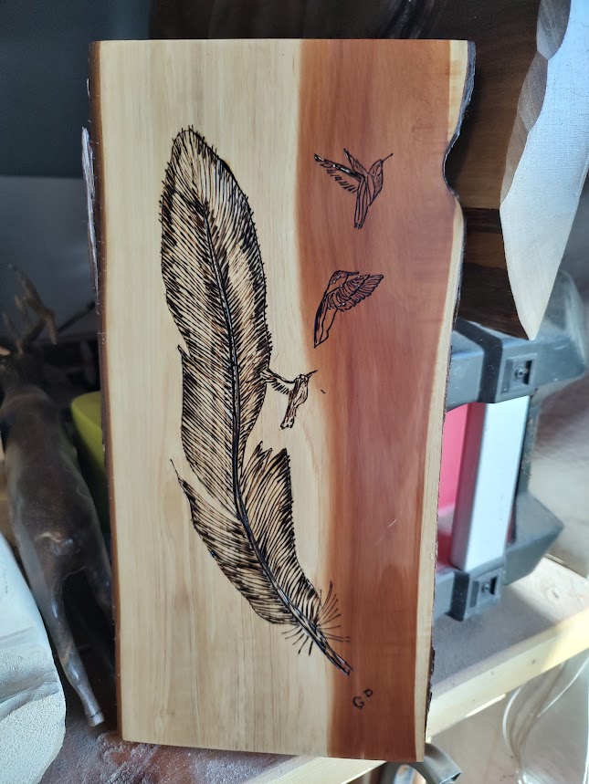 Aromatic cedar with a feather and hummers burned in